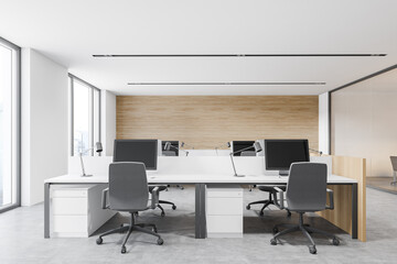 Modern white and wooden workplace in open space office