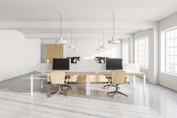 Modern white open space office with wooden tables