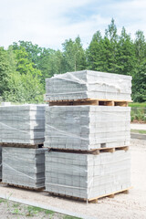 Lot of pallets with bloks for road street works