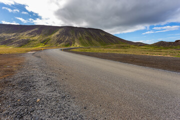 Typical Icelandic landscape with asphalt road, Iceland.