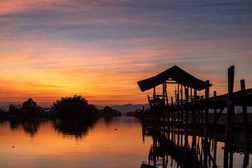 Fototapeta na wymiar Sunset at the Maing Thouk Wooden Bridge
