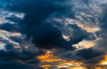 Beautiful sunset. Orange and black clouds in the sky
