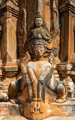 Fototapeta na wymiar Ancient guardian statue at pagoda field in Sagar