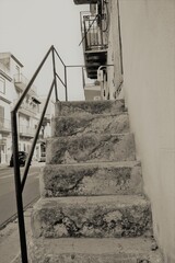 evocative black and white image of ancient external stone stairs