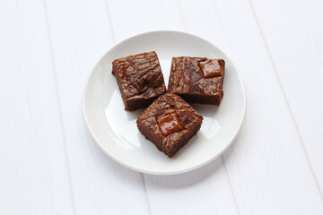 Homemade brownies with milk chocolate chunks on top