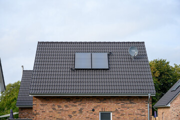 thermal solar system as energy source of the future on a newly built house roof