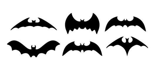 Black silhouettes of bats. Cave black bats group isolated on white vector Halloween background. Silhouettes of flying bats traditional Halloween symbols on white.
