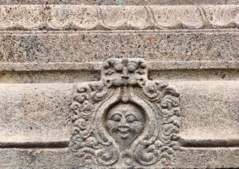 Bas relief sculpture carved in the walls of Kapaleeshwarar temple in Tamilnadu. Texture design in the walls of the ancient temple.