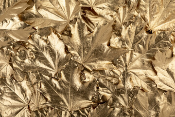 background from golden maple leaves. texture. top view