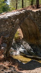 Fototapeta premium Medieval Stone Bridge with river flowing underneath it
