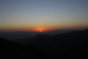 Fototapeta premium sunset over the mountains