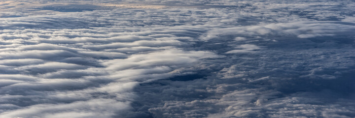 Over the clouds. Fantastic panoramic background with clouds
