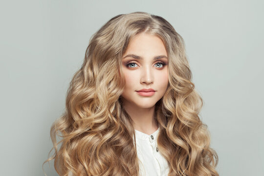 Attractive blonde woman with long healthy curly hair