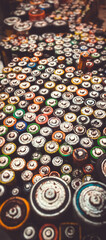 Old used batteries group. Top view vertical banner background