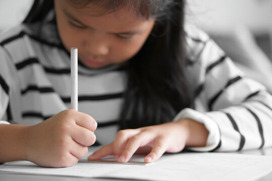 Asian Child Cute Or Kid Girl Writing Or Draw A Line And Doing Homework Or Happy Learn From Home And Training Write By Pencil And Ruler On Paper Book With Table For Study Online From Back To School