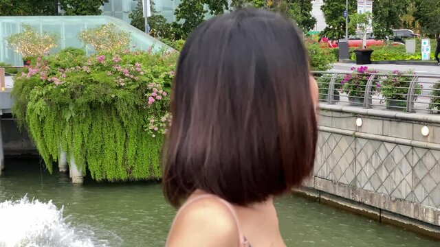 Two asian female friends outdoor talking and smiling. Friendship and holiday concept