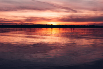 Fototapeta na wymiar Dark sunset sky over the river