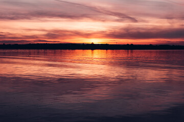 Dark sunset sky over the river