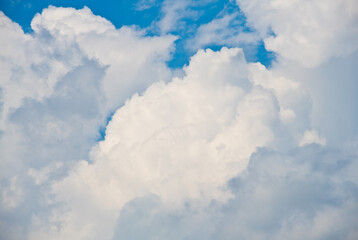 Naklejka na ściany i meble Grey and white clouds in the sky (background)
