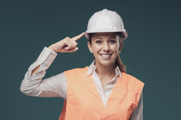 Woman wearing protective workwear and safety helmet