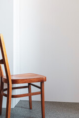 Fototapeta premium wooden chair near wall background