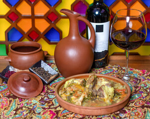 Beef meat soup with a wine bottle