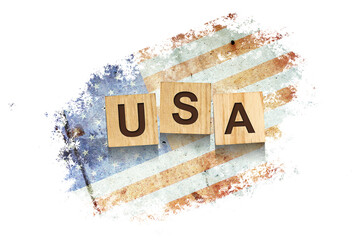 USA. The inscription on wooden blocks, against the background of the flag of America. Isolated on a white background.