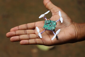 nano drone also called by names mini drones or quadcopter held in hand
