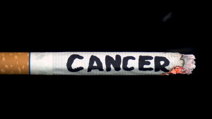 A cigarette smolders with the word 