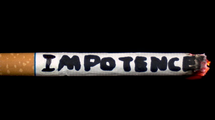 A cigarette smolders with the word 
