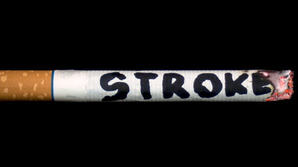 A cigarette smolders with the word 