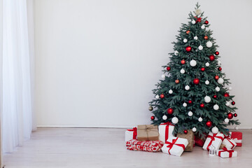 Christmas tree blue pine with gifts interior decor white room new year winter holiday