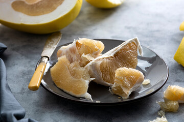 Sliced pomelo fruit isolated. Delicious citrus fruit. Healthy food.