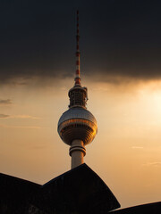 The famous Berlin TV tower behind a fountain on Berlin's Alexanderplatz