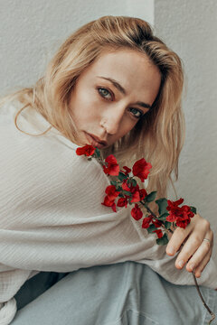 Woman And Red Flowers