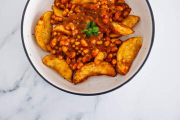 plant-based food, potato wedges with baked beans