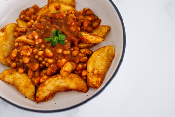 plant-based food, potato wedges with baked beans