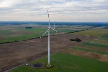 Wind turbine on a wind farm under windy and cloudy weather conditions