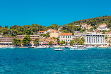 Fototapeta na wymiar The old harbour at Hvar island, at the coast of Croatia, on a sunny day, summer time.