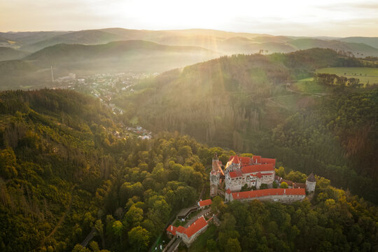 Pernstejn Castle called Bernstein is a castle on a rock above the village of Nedvedice, northwest of Brno, known as the marble castle because of the marble-like stone used to frame the doors and windo