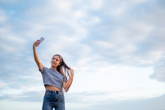 Woman Selfie Portrait With Blue Sky