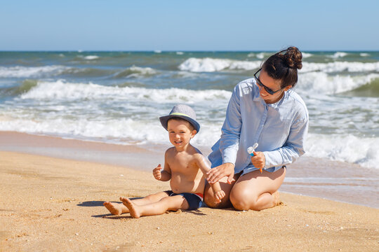 Mother Applying Sunscreen Cream