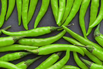 Hot green pepper. Chilean pepper on a black.
