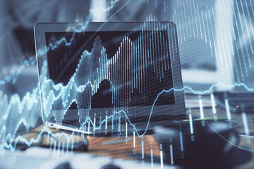 Forex Chart hologram on table with computer background. Double exposure. Concept of financial markets.