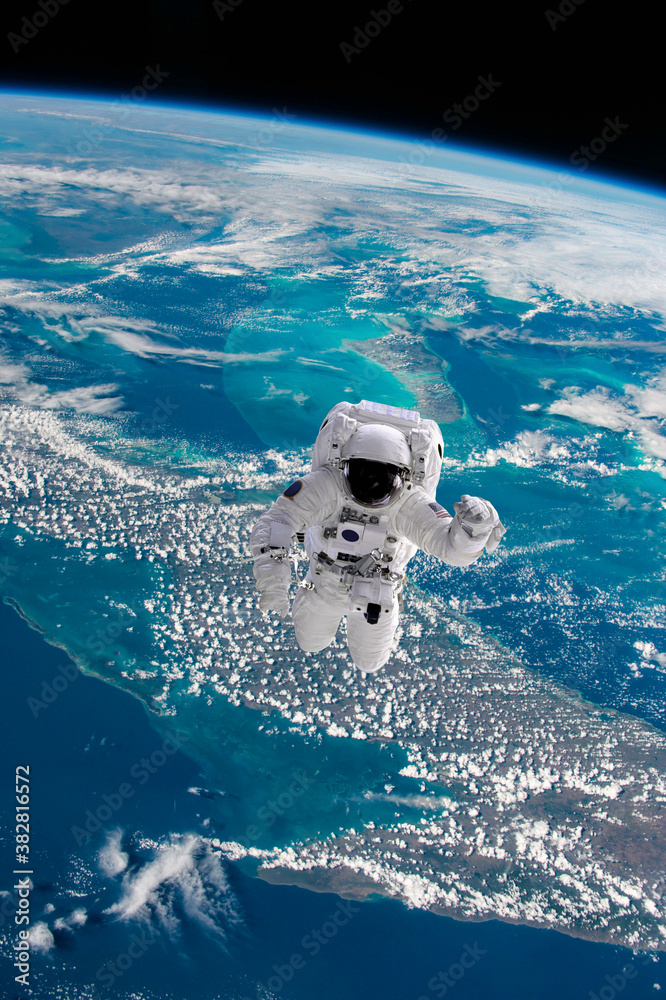 Sticker astronaut walking in space with earth background. elements of this image furnished by nasa