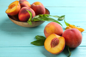 Fototapeta na wymiar Fresh sweet peaches on turquoise wooden table