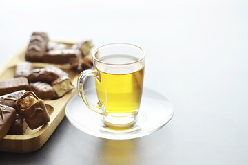 Chocolate bars on a black background in backlight. Chocolate with filling. Sweet sweets for snack and tea.