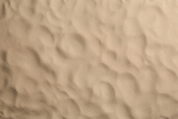 Dry beach sand as background, top view
