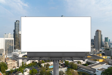 Blank white road billboard with Bangkok cityscape background at day time. Street advertising poster, mock up, 3D rendering. Front view. The concept of marketing communication to promote or sell idea.