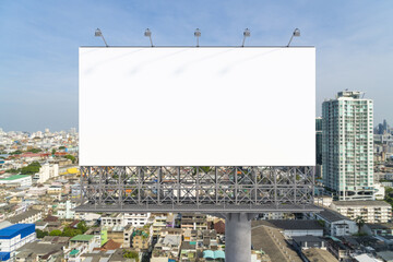 Obraz premium Blank white road billboard with Bangkok cityscape background at day time. Street advertising poster, mock up, 3D rendering. Front view. The concept of marketing communication to promote or sell idea.